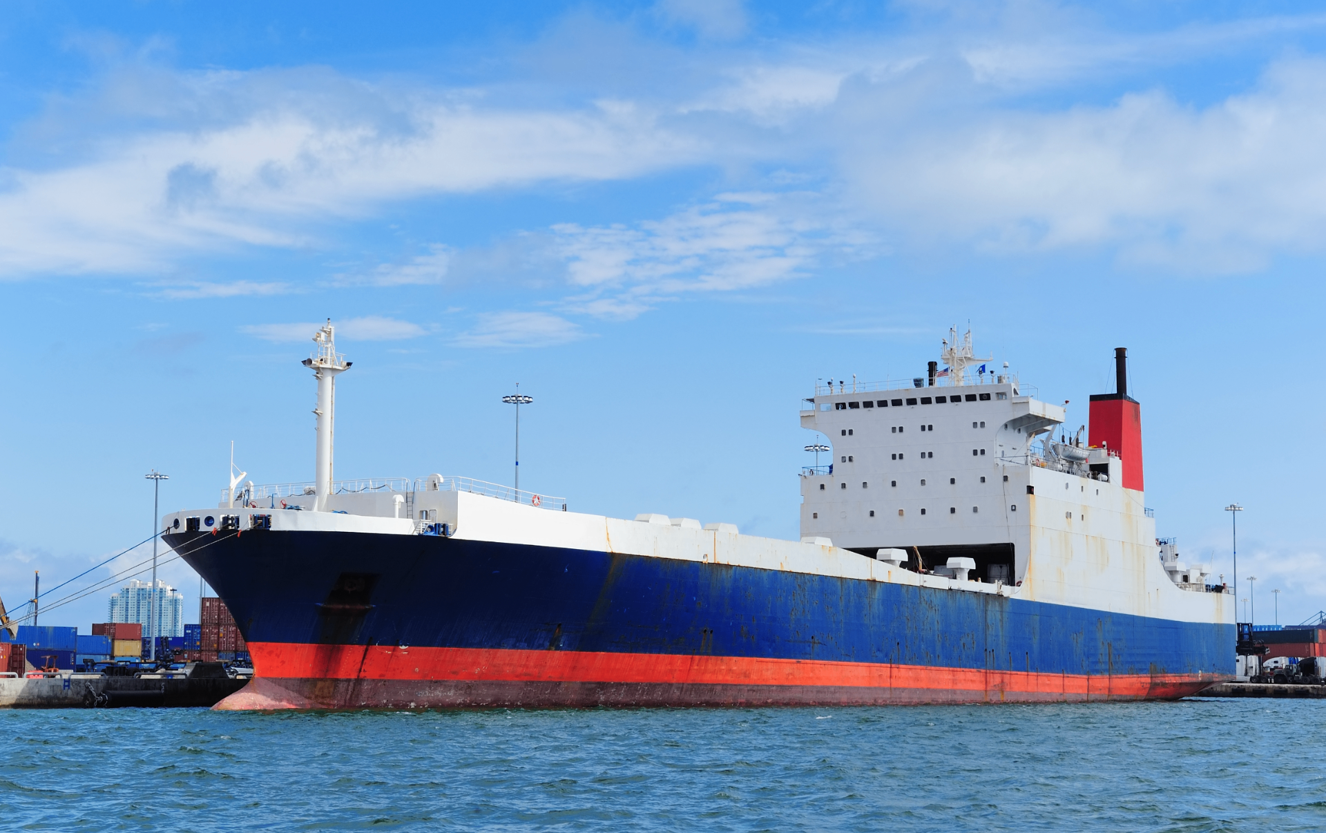 Bulk cargo vessel docked at port — steel plate imports into South Africa